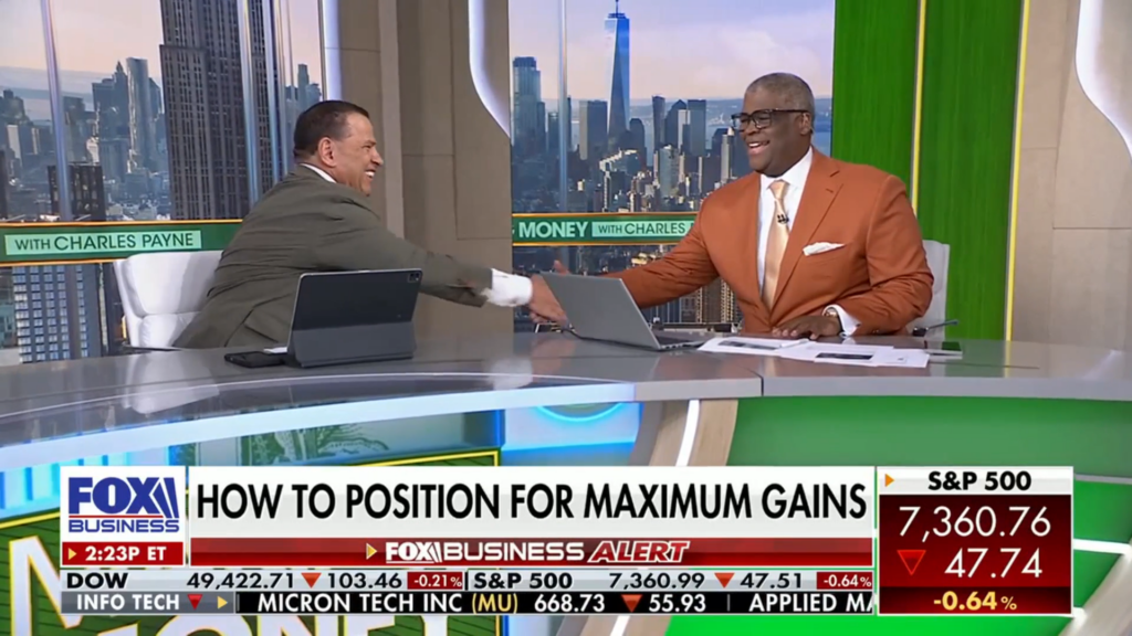 Chris McMahon and Charles Payne shaking hands