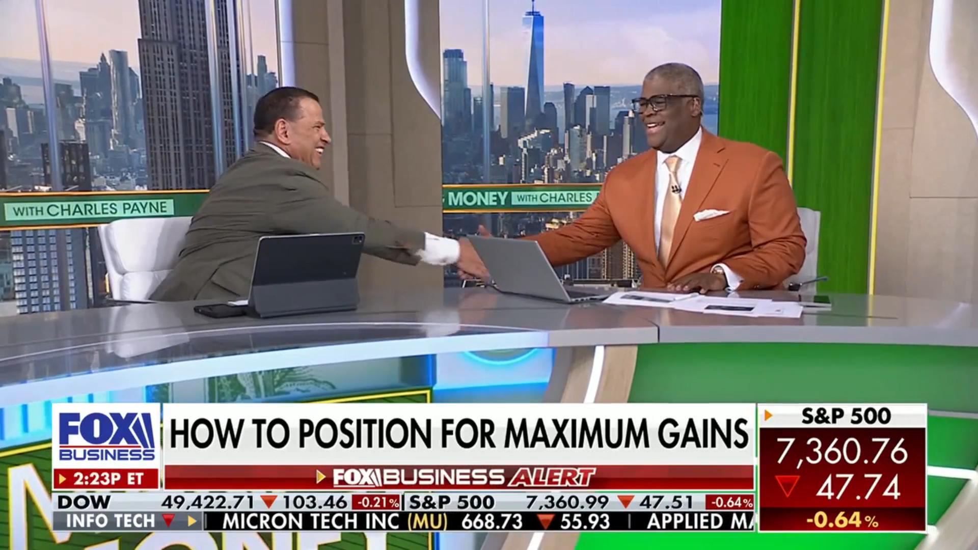 Chris McMahon and Charles Payne shaking hands